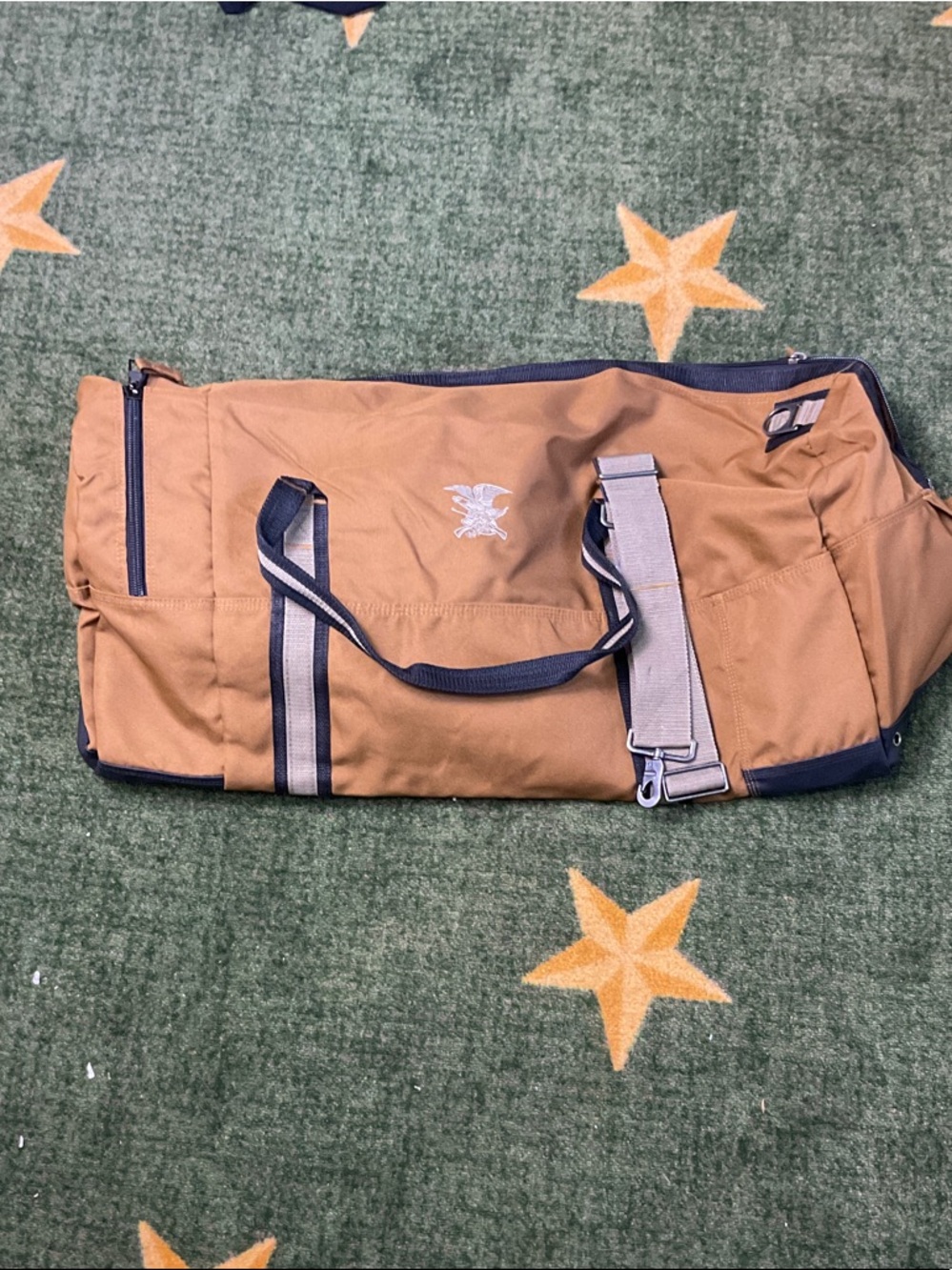 NRA SYMBOL Tan Canvas Duffel Bag with Navy Black Trim and Shoulder Strap